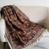 Rust floral throw blanket couch